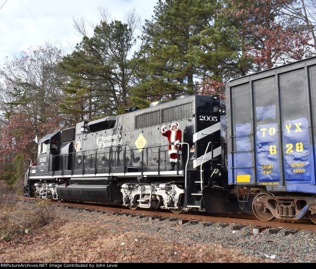 Rear side view of Chesapeake & Delaware GP38-2 # 2005 on the Delaware & Raritan River Railroad Toys for Tots Train adjacent to Collingwood Auction & Flea Market